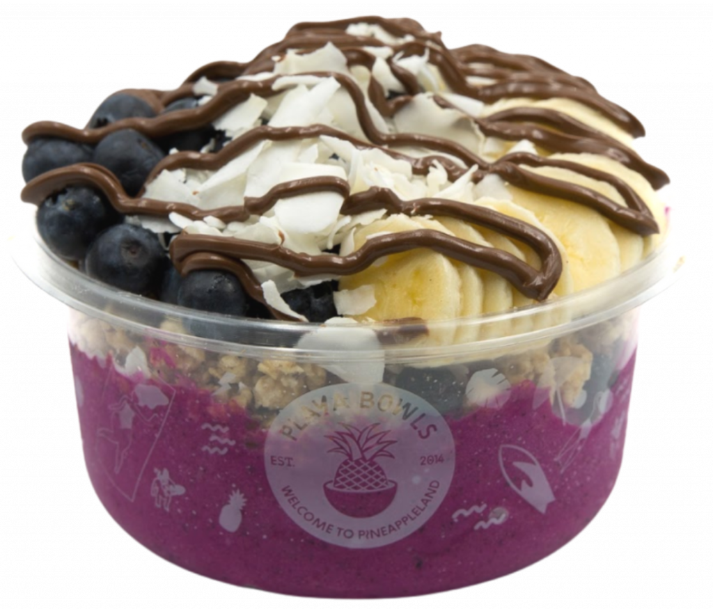 Pitaya blend topped with granola, banana, blueberry, coconut flakes, raw cacao, nutella drizzle